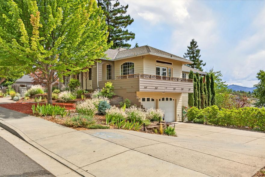 Two homes! Spacious 4,639 sq ft total of 3-stories, 4 car garage - all custom-built in 2004 with luxury & practicality in mind on a 0.22 acre lot. Main home features 3 bedrooms, 2.5 baths, living room (w pull down 10 ft movie screen projector), office, kitchen w granite countertops, 14 ft island that seats 10 chairs comfortably, formal dining w 9 ft ceilings, & ADA friendly hallways & bathrooms.  Second attached unit w separate entrance is on the main level living & great for potential rental income. Includes 1 full bedroom, full kitchen, living room, bathroom, & laundry w deadbolt doors for add'l privacy from the main home. Huge 1100 sq ft basement plumbed for a future bathroom or use for even more storage needs. Easy to maintain & beautifully landscaped yard, 25 ft rock climbing wall, & stunning views of the valley. FOUR car finished 1100 sq ft garage + Storage galore in pantry room w ductless HVAC unit. Close to town for amenities & located near Prescott park for hiking & biking tr