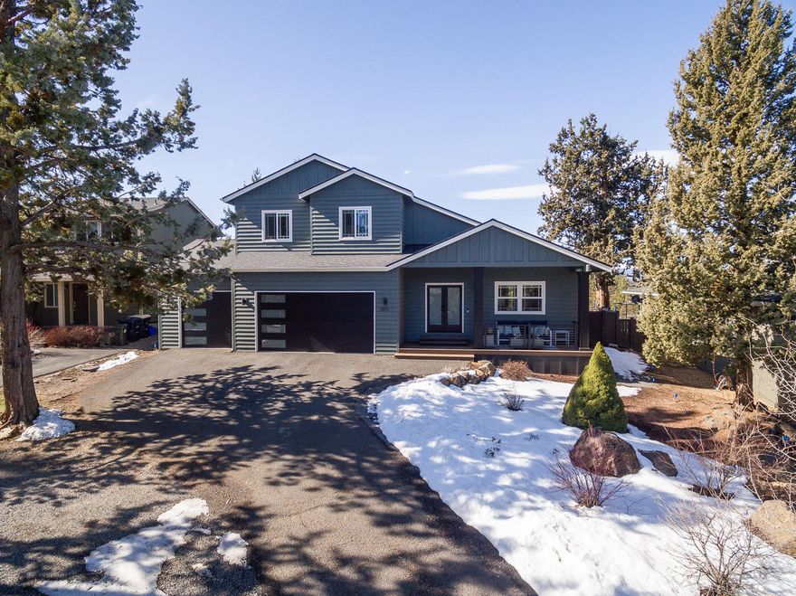 Updated Awbrey Ridge home on Bend's Westside with sweeping Mountain Views on over a quarter acre. 2,836 sqft, 3 bedroom & 2.5 bath, primary on main with walk-in closet & deck access. Open bonus room with private balcony, great room & dining room with vaulted ceilings & double-sided gas fireplace. Generously sized guest rooms with custom closet inserts & new ceiling fans throughout. Updated kitchen with quartz countertops, backsplash, sink, fixtures, under cabinet lighting & new appliances. Laundry room with cabinetry & storage. Oversized 3-car garage, enclosed single bay with ductless heating/cooling. New roof (2023) & garage doors with smart openers. New back & front Trex decking, understructure, columns, railings, & trim. New front door, exterior lighting & fresh interior paint, including garage. Fenced backyard, enclosed dog run & room for storage. Added additional parking off driveway. Situated on quiet street, close to parks, schools, trails, & all the amenities Bend has to offer