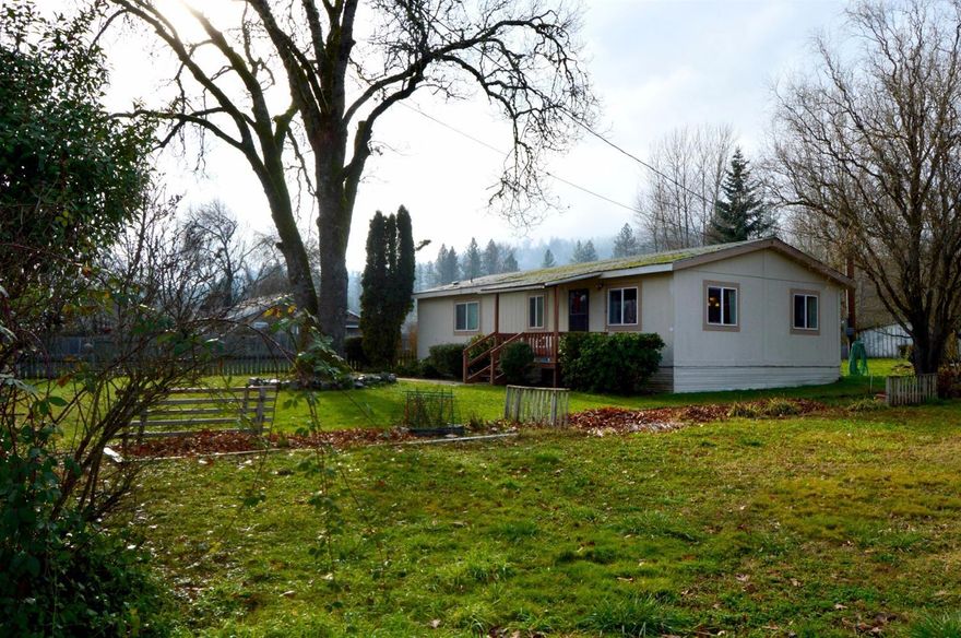 Country feeling just minutes to Grants Pass, local shopping and hospital. 2.44 irrigated acres cross fenced and ready for your livestock and garden. 2 bedroom 2 bath home with carport, shed and detached shop. Plenty of room to park your RV and vehicles off street. Mature red & yellow delicious apple,pear and plum trees throughout the property. Recent well on file. All information deemed reliable, but not guaranteed. All information should be independently verified.