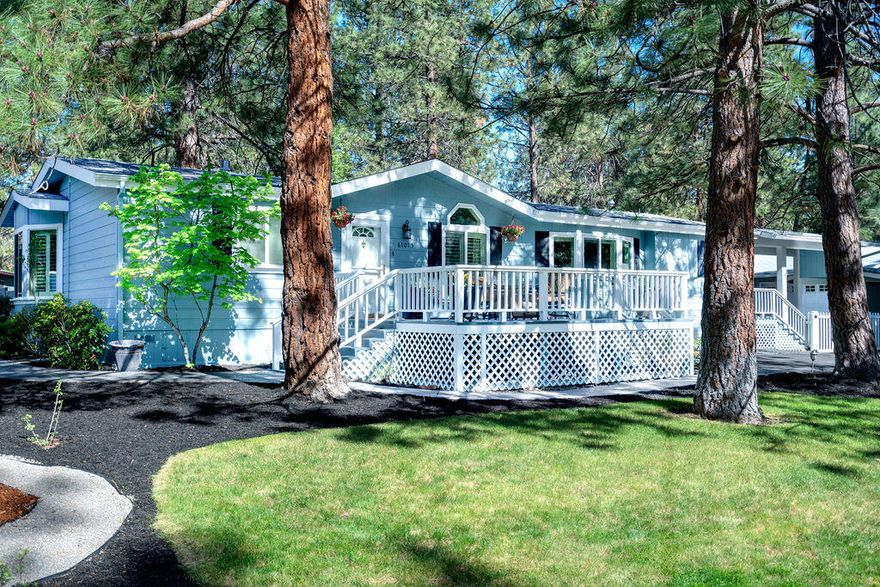 Imagine living in the peaceful Ponderosa Pines of SW Bend, mere minutes away from all the amenities you need. You will find this meticulously maintained 3BR 2 Bath home situated on a large .46 acre corner lot! It boasts granite tile counters, ample custom cabinetry in the spacious kitchen, a skylight and jetted tub in the primary bathroom, & a walk-in closet in each bedroom. New landscaping and recent exterior paint provide fresh curb appeal. Currently used as a terrific short-term rental, the next owner will be eligible to apply for a new STR permit. Inquire for more details. All furnishings & décor are available for purchase, making it truly turn-key. The property is partially fenced with gated RV parking. Storage abounds with an oversized 2 car garage connected to a 840sq/ft shop with a propane fireplace, ductless system for heating & cooling, epoxy floor & tons of built in cabinetry. Additional 200 sq/ft shed with lean-to and attached garden shed to store even more tools & toys!