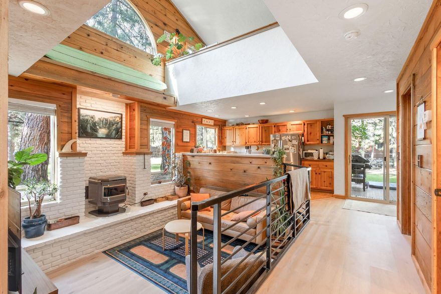 Turn-key short term rental in Tollgate now featuring a new sauna and cold plunge! The half-acre lot is level, fenced, and scattered with mature pine trees. The open floor plan features a vaulted ceiling in great room with large windows, and a versatile loft area above, all enhanced by new LVP flooring throughout the home. The sunken living room centers around a pellet stove with a stunning white brick hearth. The kitchen, overlooking the great room, features beautiful wood cabinetry and solid-surface countertops. Tongue and groove accent walls add warmth and character throughout. The home boasts a built-in dining area, a spacious laundry room, and a new tile shower. 1 bedroom downstairs and 2 upstairs. The community amenities include a pool, clubhouse, tennis/pickleball courts, trails, and more. The Tollgate community allows for vacation rentals making this home a turn-key income-producing Airbnb. Inquire for STR revenue estimate.