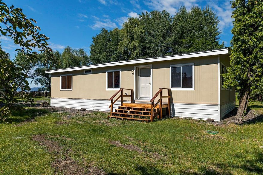 This is a great place to have horses and animals right out in the middle of the farming area. The 1976 two bedroom two bath doublewide manufactured home has many updates and is surrounded by various mature trees and lots of green pasture. It has an older 60' x 36' barn, 24' x 24' shop, 24' x 30' detached garage/shop and a 14' x 26' mud room addition. The setting and the views are of the local farming and the distant views are of the Cascade Range with Mt Mcloughlin and Crater Lake rim. The location is rural but has paved roads for year round access. The irrigation is flood but the property has some sub-irrigated pasture. Hurry to see this 4.85 acres in the Modoc Point area.