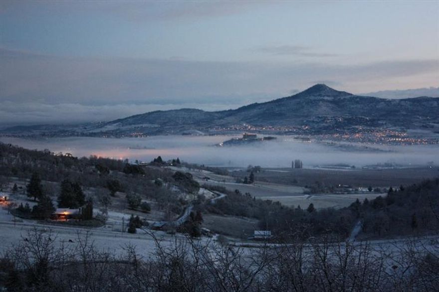 Panoramic views from every picture window! Enjoy country living while being tucked away, yet surrounded by small ranches and vineyards, and minutes to both Medford, Ashland & Jville. Custom built home sits on 6 private fenced acres, pasture for horses, 6 stall barn, plus a 3 stall foaling barn/equip. shed. Gated entry, paved road to the top of the hill with plenty of parking. Home is a 3 bedroom with the 4th being an office. Master suite is on the top floor with a beautiful newly remodeled bathroom with heated tile floors, tile shower, sunken jetted tub, granite counters, and a walk in closet. On main level enjoy the warm pellet stove in living room, formal dining, and the fabulous new custom kitchen with alder cabinets, granite counters, stainless steel appliances, plus a slab granite island, with built in table. Downstairs has a large bedroom, family room with a bonus area. Enjoy country living while you live the OREGON DREAM. Don't miss seeing this one of a kind!