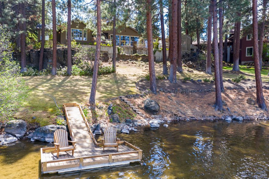 Work from home and look out at the one-of-a-kind riverfront setting in NW Bend. From the moment you walk through the courtyard into this single level home, you're captivated by the breathtaking Deschutes River views. Easy access to the river and your own private dock. Great room features beautiful oak hardwood floors, large windows frame the scenic riverfront setting, stone gas fireplace with artwork lighting, and French doors to the back patio. Gourmet kitchen features, custom cabinetry, slab granite countertops, instant hot water, and Viking stainless steel appliances. Spacious master suite with river views, private access to back patio and walk-in closet with built-ins. Luxurious master bath features 2 separate vanities, soaking tub with travertine surround and large walk-in shower with dual shower heads. Office with river views, oak hardwood floors and built-ins. Guest en suite that with access to deck. Relax in your hot tub and enjoy this stunning home and view!