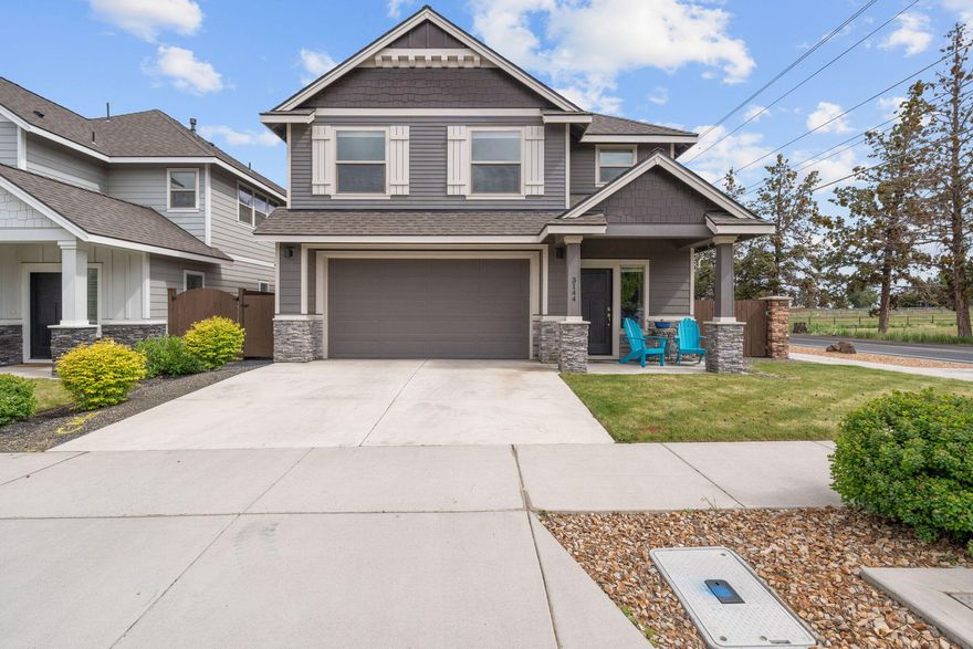 Welcome to this inviting 4-bedroom, 2.5-bath home in the desirable Mirada neighborhood, known for its welcoming community, front yard maintenance, and fantastic amenities. With 2,130 sq ft of well-designed space, this home features an open-concept layout that connects the living, dining, and kitchen areas—perfect for both daily living and entertaining. The spacious primary suite offers high ceilings and a relaxing atmosphere, while the kitchen shines with sleek quartz countertops. Step outside to the low-maintenance backyard and take in sunset views over the mountains from the covered patio. Additional perks include a side yard for RV parking or extra storage. Enjoy access to Mirada's private pool and 4-acre park just steps from your door. Whether you're settling into your forever home or seeking a smart investment, this property blends comfort, style, and convenience in one of NE Bend's most sought-after neighborhoods.