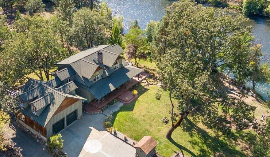 One of the most Heavenly and Magical settings you will ever find on the Rogue River in this fully furnished 4 bedroom 4 bathroom home.  Enjoy watching eagles, osprey, ducks, geese, turkeys or fish for salmon, steelhead and trout with over 140+ ft of River frontage, or just relax in your Hot Tub/Spa overlooking the river.  No more daydreaming about living on the river when you purchase this custom craftsman home over 2875 sq.ft (all permitted) to enjoy with natural sunlight and over 2100 sq.ft. wrap around deck which provides great outdoor entertaining.  Entire home completely remodeled in 2021.  Everything is fresh and new including Stainless Bosh Appliances, granite and backsplash, flooring, well and much much more.   Separate fully furnished and legal Accessory Dwelling Unit (ADU) is currently being used as a profitable short term rental.  Private, Peaceful and Perfect.