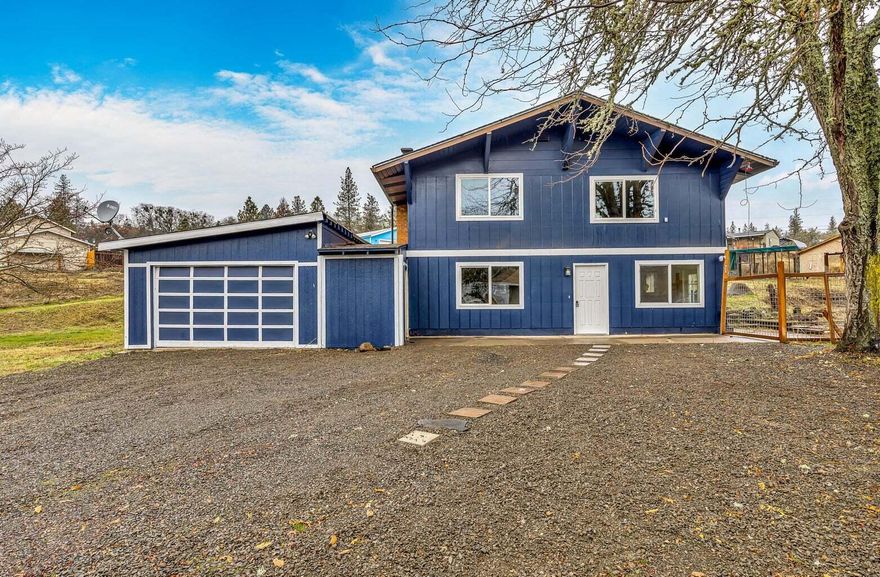 VA Appraisal on file for $411,000/April 2025. New fencing & new solar in 2024, new heat pump 7/2025. Nestled on a 1/3-AC lot, this 4-bdrm, 2-bath home is a captivating masterpiece awaiting your arrival. With 2,542-SF of carefully curated living space, this abode combines modern elegance with charm. The recent updates boast new flooring light fixtures. Freshly painted walls create an inviting canvas for your dreams to unfold. Indulge in pure bliss within the remodeled bathrooms, an oasis of tranquility where stress vanishes like a distant memory. The magic continues outdoors, where a large, fully fenced backyard beckons you to savor the wonders of nature. Host memorable gatherings or cherish intimate moments while enjoying the gentle breeze from the nearby Rogue River. Education and convenience converge at your doorstep, as the sought-after Shady Cove school, library, and post office are close by. Abundant parking spaces accommodate all your guests effortlessly.