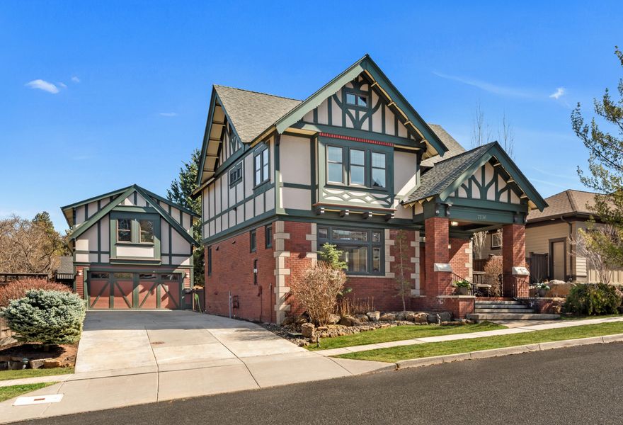 Charming English Tudor with detached ADU/Apartment close to the Old Mill District, Deschutes River, Trails & Parks. This unique property includes a beautiful custom home with 3 bedrooms 2 ½ baths AND separate 1 bed/1 bath apartment with private entrance over detached 2 car garage (House + ADU = 2,503 sqft). This special property exudes quality and uniqueness throughout. Classic styling including extensive use of brick and decorative trim & woodwork. Gorgeous kitchen with Dacor 6 burner range, Sub-Zero Fridge and new countertops & backsplash. Impressive living room with wood ceiling, exposed timber frame trusses, and stone fireplace flows to the inviting & private fully landscaped backyard with covered deck. Stone flooring throughout the main level. Primary on the 2nd floor includes vaulted ceilings with exposed beams and an elegant bathroom with classic clawfoot tub & walk-in shower. Square footage of the main house does not include a fully finished attic space for your creative use.