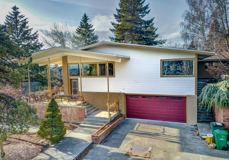 Located in the Hot Springs neighborhood, this home has many updates throughout. Features include; hardwood flooring with wood inlay accents, cultured stone fireplace with bench seating, custom built-in curio cabinets, wine cellar, surround sound and geothermal heating. You will find lots of windows throughout bringing an abundance of natural lighting and a deck to enjoy the view.  The kitchen is a cook's dream and has had extensive remodeling with custom cabinetry, granite countertops, high end appliances, copper farm sink, built-in breakfast table and lots of storage space. The Master bedroom has access to the deck and a master bath with dual sinks, walk-in shower and jetted tub. On the lower level is a family room, large laundry room and a craft room which has the potential of a 4th bedroom. The lot size is .45 acres with many fruit trees, shed, dog kennel, fire pit and raised garden beds. Conveniently located near OIT and Sky Lakes Medical Center.