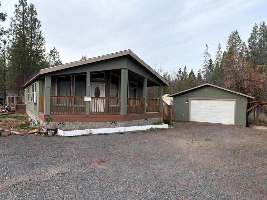 Assumable 3.75% interest rate for qualified buyers with under $50,000 down - ask for details! Enjoy the feel of rural living on the edge of town, surrounded by large parcels, while only maintaining an approx. ¼-acre lot. This upgraded manufactured built in 2020 home offers big view windows framing Mt. McLoughlin and the surrounding fields. The primary suite features a slider to the deck, a spacious bath with walk-in shower, and a separate soaking tub. Outside, relax under the covered front area for year-round entertaining, or spread out in the large, private backyard with room for a garden. Property backs to a wooded area. Oversized 20x20 garage, plus a large rocked area for RV parking.