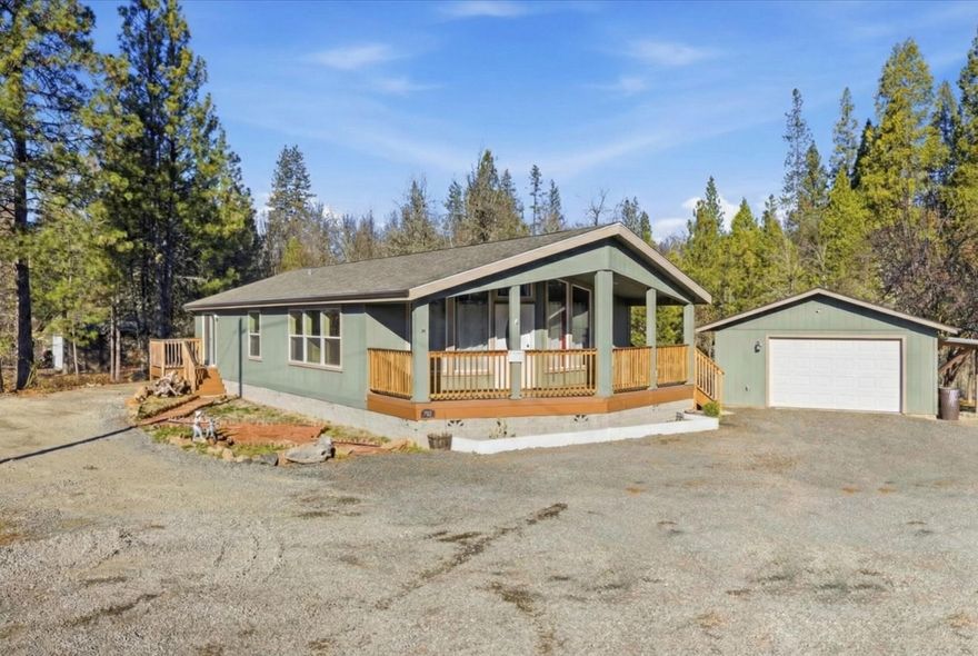 Assumable 3.75% interest rate for qualified buyers with under $50,000 down - ask for details! Enjoy the feel of rural living on the edge of town, surrounded by large parcels, while only maintaining an approx. ¼-acre lot. This upgraded manufactured built in 2020 home offers big view windows framing Mt. McLoughlin and the surrounding fields. The primary suite features a slider to the deck, a spacious bath with walk-in shower, and a separate soaking tub. Outside, relax under the covered front area for year-round entertaining, or spread out in the large, private backyard with room for a garden. Property backs to a wooded area. Oversized 20x20 garage, plus a large rocked area for RV parking.