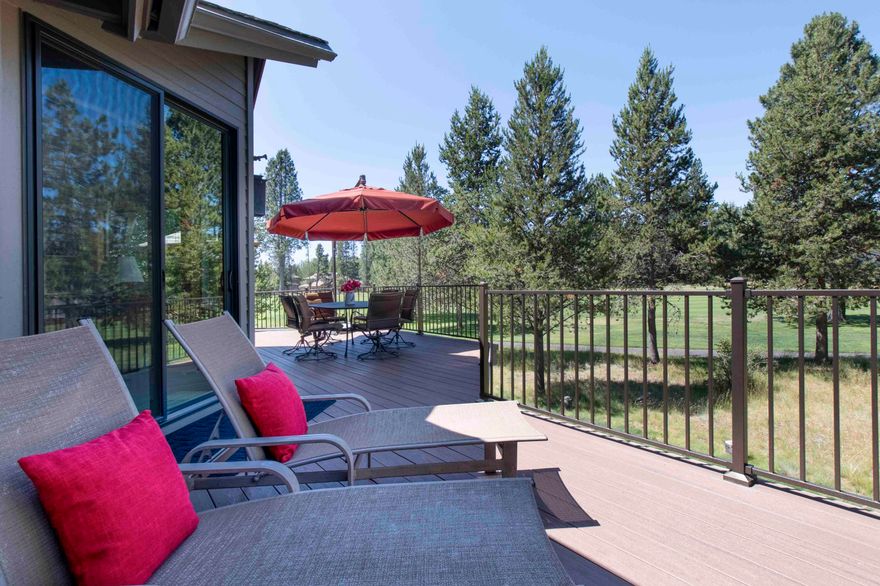 Custom-built Steve Madsen home on Woodlands GC, now available for the first time on the market! This remarkable property offers a reverse living layout that creates a captivating tree house feel, offering glimpses of Mt. Bachelor. Upstairs the vaulted great room is highlighted by a cozy wood-burning fireplace. Cook's dream kitchen features excellent storage, granite countertops, convenient eating bar, and spacious pantry. Access the front deck from the kitchen for outdoor dining and entertaining. Recent upgrades include newer low-e windows throughout, ensuring energy efficiency and a modern aesthetic. Expansive rear Timbertech deck looks out to the GC. Upstairs, ductless cooling provides comfort during the warmest days. The home boasts 3 bedroom suites, providing ultimate comfort and privacy for all. The 2-car garage offers storage space for recreational gear. SHARC Paid. Live your dream in this custom home, where every detail was carefully considered!