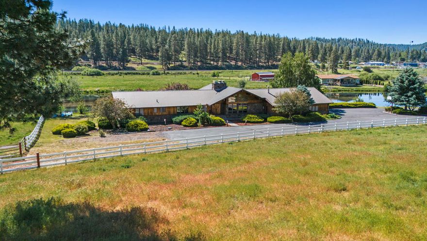 Nestled along the scenic Williamson River in Chiloquin, OR, this 60-acre property offers stunning river and pine hill views, with land on both sides of the river ensuring privacy. A fisherman's dream, it features 2700 feet of river frontage and is steps away from prime trout fishing. Ideal for canoeing, kayaking, floating directly from the house, it's also perfect for pets, horses, and summer cattle. The property provides easy access to Hwy 97, Medford/Ashland and 1 mile from a small airport. Nearby areas offer camping, hiking, mountain biking and boating, with surrounding gems like Crater Lake, Wood River, and Collier Park. This home boasts a large garage, a river-side deck for relaxing and entertaining, stunning window views throughout, a spacious kitchen with a butcher-block island, an entertainment bar and a dual-sided stone and brick fireplace with an indoor barbeque. Ideal for outdoor enthusiasts, waterfront living, and simple country life.