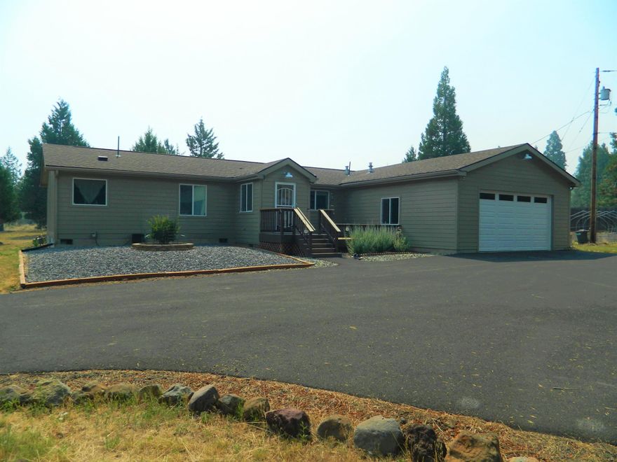 This 2042 Sq Ft 3 bedroom 2 bath manufactured home sits  on 4.68 acres. It has a very open floor plan with an island in the kitchen including a breakfast bar and Corion counters.Vaulted ceiling and split floor plan. There is a separate office  and added family room. Laminate floors, carpet and vinyl. There is a 40x44 shop with an RV area.House has cental gas heat and A/C. Very peaceful setting ready to call home