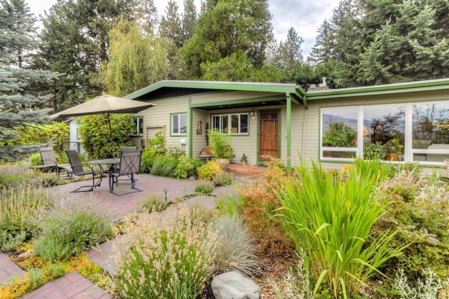 Lovingly renovated, sustainable Zen inspired peaceful, light-filled haven with multiple skylights, vaulted living, custom fireplace, solid wood flooring and doors, den/office, and gorgeous kitchen with sustainably harvested maple cabinetry, custom concrete counters, and top-of-the-line appliances. You'll love the stylish, redesigned baths and an expansive master suite, including large sitting area, Australian wool carpet, two-person tub and steam shower. The close-in view lot is a true oasis, with over 200 new trees and plants, two private patios, hot tub, garden art studio, new fencing and exterior lighting, organic garden beds and new drip irrigation. The 2009 to-the-studs remodel used green standards with non-VOC paint, high-efficiency HVAC, on-demand hot water, new plumbing and wiring, Hardi-plank siding, LED lighting, whole-house water filtration, non-formaldehyde insulation, & membrane roofing. Wonderful!
