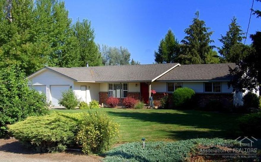 Country feel on Apollo Road. A homey presentation welcomes you into this 3 bed, 2 bath, 1726sf single level home. Living room and family room w/slider to large patio/deck and large utility w/sink. Updates include newer appliances, windows and flooring. Enjoy the beautiful landscaped outdoor living area, 1 acre fenced, irrigated pasture w/semi solid set lines. Room for animals and toys. Just minutes to town from this immaculate single level home. Tired of being squeezed? This home is move in ready!