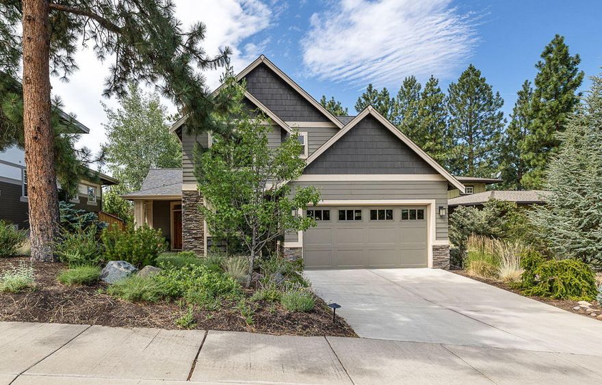 Beautifully appointed, light filled home in sought-after NW Bend's Marken Heights. The entry immediately welcomes you with gorgeous views through to the outdoors, expertly created into a private, custom landscaped & fenced backyard complete with large covered entertaining patio & paver walkways. The pleasing interior aesthetic is refined with crown moldings & quality finishes throughout. Open great room complemented by skylights & gas fireplace with stacked stone surround, custom mantle & built-in cabinetry. Well-designed kitchen with Quartz counters, custom Alder cabinetry & stainless appliances. Main level flooring finished in porcelain tile throughout, including the large office for two. 3 bedrooms and 2 updated full baths upstairs including large primary suite with vaulted ceiling & large windows. Hard to find 3 space garage with overhead storage, kayak, bike & ski racks. Cul-de-sac location on private drive w/no through traffic just minutes to Westside amenities & downtown Bend.