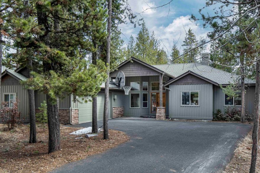 Experience resort living at its finest in this stunning Sunriver home! This lodge-style, Schumacher built, single-level retreat is located in the highly coveted River Village subdivision with easy access to the Deschutes River just down the street. Enjoy an open-concept layout with vaulted living areas, newer hardwood flooring, plus charming log & wood accents throughout. A stacked-stone gas FP adds ambiance & warms the large common space! The home boasts a breakfast nook, wonderfully efficient galley kitchen with granite counters/eating bar and formal dining area for easy entertaining! 2 Luxurious bedroom suites offer updated zero clearance showers & private access to the rear deck. The newer rear Trex deck is wired for a hot tub. 2 More guest bedrooms are served by a full hall bath. Laundry room with utility sink, 2-car garage & central A/C offer additional conveniences. Tankless HWH & newer roof. Don't miss your chance to own this slice of paradise in Sunriver!