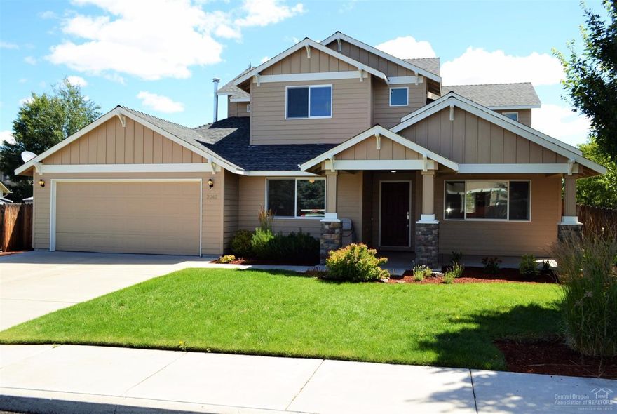 Fantastic location and large lot! This 4 bedroom, 3 bath, 2,355+/- sq.ft. home has a great floor plan. Large kitchen opens to the great room with gas fireplace and sliding glass door opening to large deck. One bedroom downstairs, full bath, plus large living/dining room and laundry room with sink. Upstairs, the master suite has vaulted ceilings, lots of windows, bathroom with double sinks and walk-in closet. This lovely home also features, gas forced air heat, A/C, tandem 3-car garage and nicely landscaped.