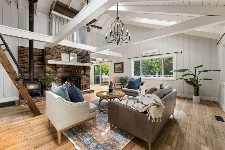 Enjoy the beauty and tranquility of nature on the stunning 3 acre property featuring a seasonal creek & charming outdoor spaces. This unique home offers 3 bedrms, plus a 336 ft.² loft providing excellent potential for multifamily living. The main level features special touches throughout, including an updated kitchen w/ subway tile, a farmhouse, apron sink, & elegant European birch countertops & soft, closed cabinetry. The white oak pegged floors & open beam ceilings create a bright, & spacious feel in the living room. Convenient additions include just off the kitchen a 32 x 16 deck offers a perfect space to relax or entertain. The primary bedroom opens to a private 20 x 12 deck w/ a hot tub for ultimate comfort. The basement features 2 of the bedrms, a stylish kitchen & a full bath ideal for guests/extended family. Pathways & cozy sitting areas lead to the creek adding to the property serene charm. Also included is a chicken coop perfect for those interested in hobby farming.