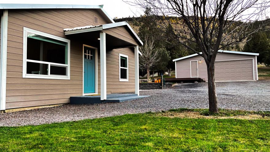 Located within the city limits of Prineville, but feeling like it's in the country, sits this superbly updated bungalow with quartz natural edge countertops, copper sink, stainless steel appliances, subway tile backsplash, and hickory floors. The large fenced yard backs up to even more land that connects to Crook County's Lower 66 Trail. Underground sprinkler system hooked to the private well with whole house filtration system keeps the landscaping growing while you enjoy Central Oregon. Located at the gateway to the Ochocos, overlooking the award winning Prineville Golf Course, this is the perfect place to invite your friends to hookup to the 30 amp RV service and enjoy the 4th of July fireworks launched off the viewpoint, and hiking, hunting, fishing, and sunshine throughout the Crooked River Basin.