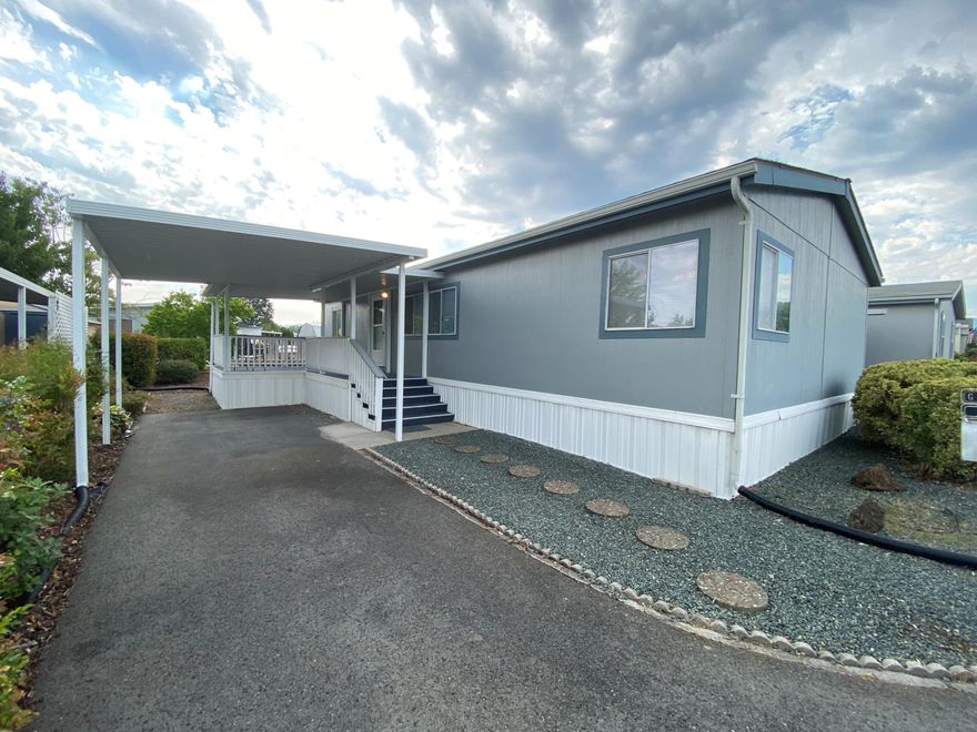 Manufactured home in Riviera Mobile Home Park. Riviera is 55+ community located in the SW part of Grants Pass, this lovely parks grounds  have Rogue River Frontage. 3 bedrooms, 2 bath, 1176 Sq ft. spacious front porch, car carport, storage shed. All kitchen appliances, washer & dryer included.  Park rent includes trash, water, and sewer. RV parking available, park approval must be obtained for potential buyers, small pet allowed with park approval.