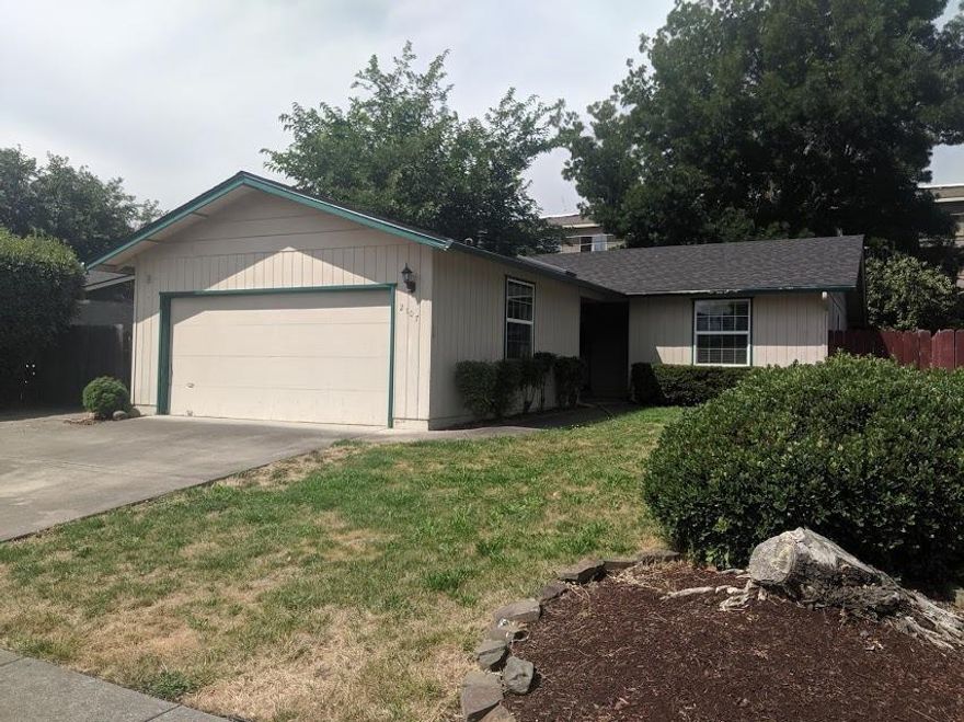 This Wonderful East Medford home features three bedrooms/ two full bathrooms and RV parking as well as 1221 sq. ft of living space! As you enter the home you will notice a large living room, large kitchen with french doors plenty of custum built cabinets and counter space. There are three large bedrooms, the master bedroom features a walk in closet. As there is a large laundry room as well as a two car attached garage. Outside you will find a fenced patio, RV parking and mature shrubs and trees. Dont' miss out on this one!