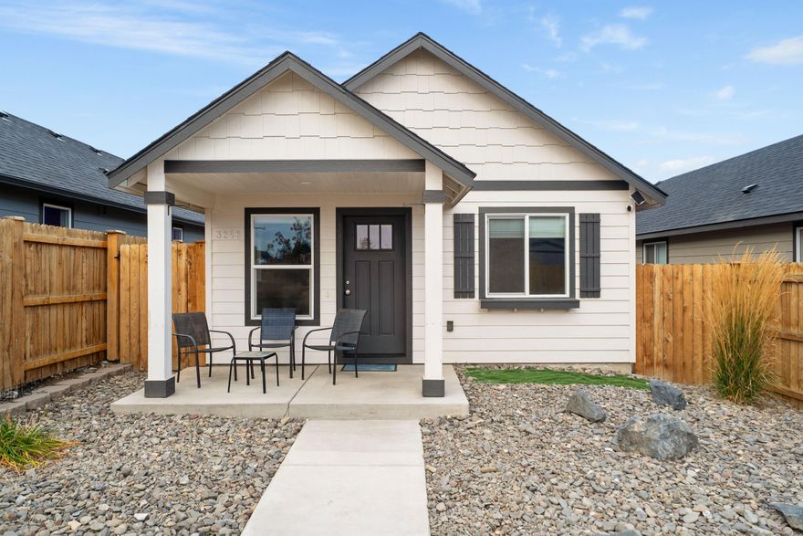 Built in 2023, this modern home lives like new: efficient, easy to care for, and move-in ready. Currently the most affordable single-family home in Redmond, it's an ideal fit for anyone seeking a smart starter home, a comfortable downsizing option, or an efficient footprint in a prime location. Enjoy fenced front and side yards that are simple to maintain yet offers space to make your own. Community garden sits across the way, adding a pleasant view, instead of facing a neighbor's house. Inside, you'll find a smart layout with contemporary finishes. Includes alley access & 2 car garage, ductless electric heating and cooling, and energy-conscious construction. Less than ten minutes from Smith Rock, .2 miles from Elton Gregory Middle School, Tom Mccall Elementary School, and direct access to 97 (Via Upas). Located in Redmond's desirable Cinder Butte Village, you'll love being close to trail systems and parks—with some of the most impressive local mountain views on your drive home!