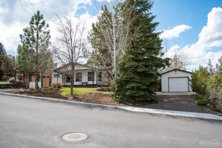 Hurry to see this uniquely charming home on a corner lot in SW Redmond. Recently remodeled kitchen with wood & steel cupboard doors, limestone solid counters, gas stove and a walk in pantry. Solar tube in the kitchen keeps it light and bright. Great bedroom separation. The large master bedroom features some build ins and an awesome double sized, walk in shower in the master bath. Pozzi Wood windows throughout. Paved and gated side yard for RV or boat storage. Fully landscaped fenced back yard.The .25 acre lot gives you lots of room for all your toys and hobbies. The single car garage is detached with lots of additional parking.