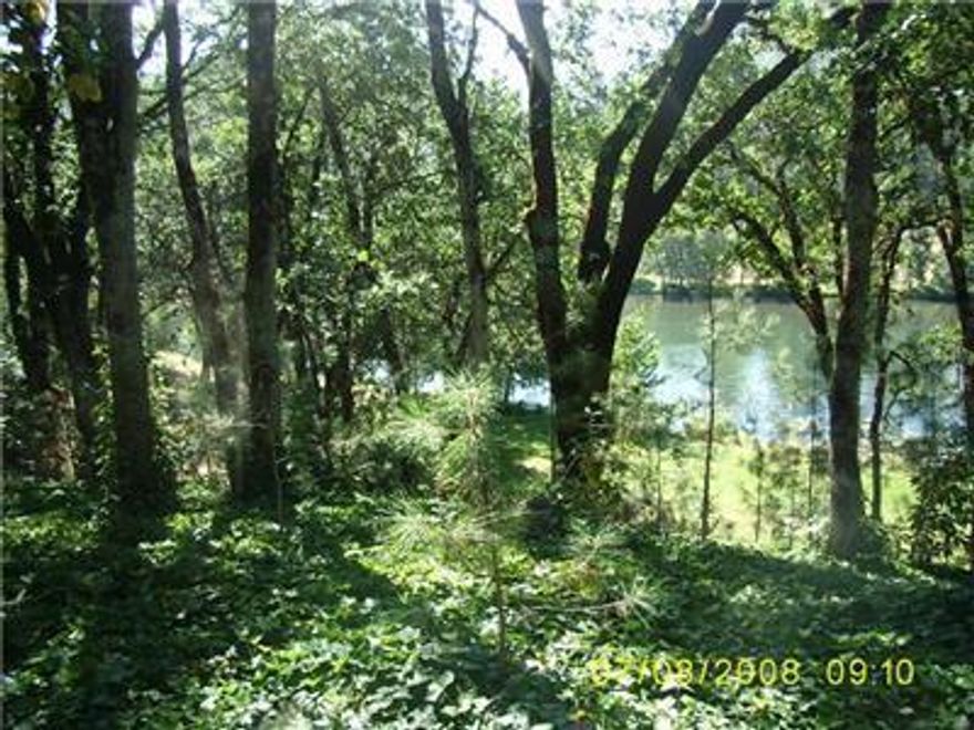 Fabulous River Frontage property that sits above the flood plain. Property features 155.41' of Rogue River Frontage. Level building site, in ground sprinklers, standard septic approval and well installed. Located between 2 class 4/5 riffles, this portion of the river is very private with no public access. Conveniently located between Medford and Grants Pass. Last buildable lot in the section of the river. Please park on the road not the lawn when viewing.