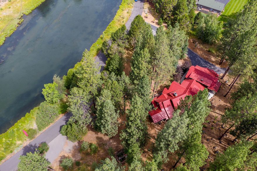 One-of-a-kind, timber Framed Home along 1/4 of a mile of a private & peaceful stretch of the Deschutes River. This geothermal home is appointed with exotic woods (inside & out) & offers unbelievable finishes. This John Jordan designed home, built by Ridgeline Custom Homes & timber framed by Oregon Timber Works, boasts a grand 2 story great room w/ 2 story indigenous stone fireplace (isokern) that draws you thru the 4 panel door to the river, a gourmet chef's kitchen w/ cherry cabinetry, expansive copper island, distinguished master retreat w/ river views, spa-like bathroom, radiant heat floors, walk-in shower & soaking tub, multiple outdoor living spaces & fireplaces, 1000 sf+ 3-car garage w/ 864 sf ADU w/ separate access. Enjoy fishing from your own bank, a gated community of just 7 custom homes, minutes from Old Mill Shops and Des, River/Mt. Bachelor recreation! There is only one of these homes that offers something for everyone - book your showing and secure this great home!