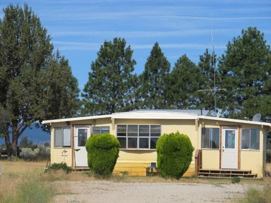 A Surprise 5 Acres In The Country, Great Get Out Of The City Property . Room For Animals ,Horses, Cow, Goat You Name It. Owner Is In The Process Of A Small Kitchen Remodel. There Are Several Buildings Including A Barn,With 2 Large Rooms One Is Being Used As A Woodwork Shop. The Other Storage. All Fenced And Cross Fenced With Dryland Grass Pasture. Huge Garden With Lateral Water Lines. This Is A Must See Price Is Firm.