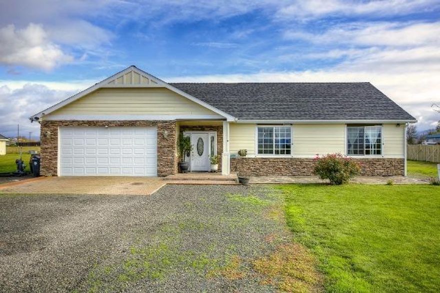 Close in country living. 2006 built 1838 sq. ft. frame home on 3.45 irrigated acres. This custom home has 3 bedrooms, & 2 full baths, plus a bonus room for office, sewing, hobby. Attractive tile entry leads to living room having a vaulted ceiling accessing an east facing patio w/ingress/egress via sliding door to enjoy sunrises & views of mountains including Mt McLoughlin. Well sized kitchen w/tile floors, loads of cabinets, center island & corner pantry. Master bedroom suite with 9 foot ceilings & master bath w/jetted tub, separate shower & linen closet. Recent upgrade to home is a whole house ventilation system. Attached & insulated garage w/finished walls. Acreage is flood irrigated by RRVID. Property is fenced & has been home to cattle & goats by current owner. 24'x32' animal shelter w/area for hay storage. 6'x8' toolshed. 10'x12'workshop. Good location for ones in 4-H. Plenty of room for multiple vehicles, large RV unit, farm equip. etc. EZ access to Hwy 62. Medford School Dist.