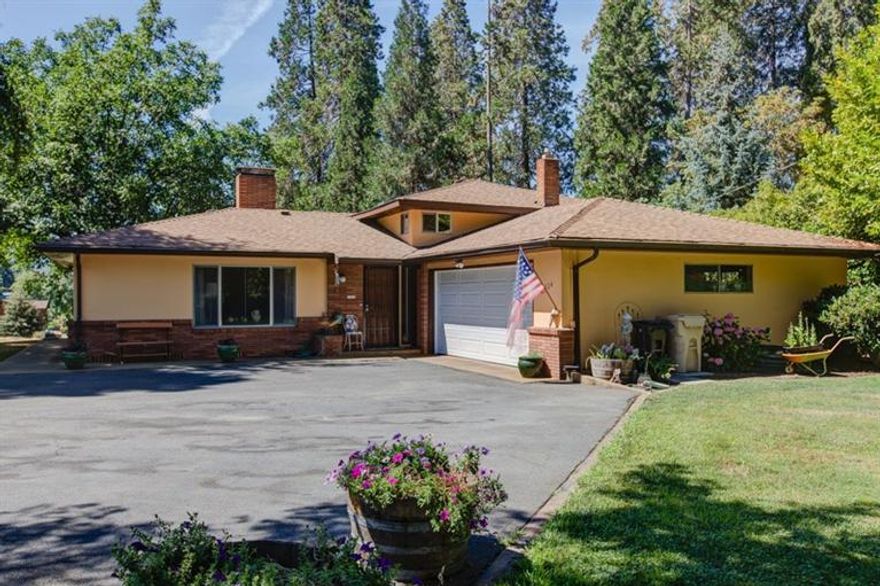 Mid Century Beauty with River view in Southern Oregon! Well maintained and shows pride of ownership throughout! Great location in Grants Pass close to schools, parks and shopping! This home offers 3 bedrooms plus Office/Den, Living room w/gas fireplace, dining room eat in kitchen, and Family room with bar. Plenty of room to entertain family and friends inside and out. Enjoy the beautiful rogue river view from one of your 2 decks year round. Garage is over-sized with work benches and storage for the hobbyist in your family. Garden area for the gardener.. this home fits the needs of many! Also wired 220 so bring your spa!!