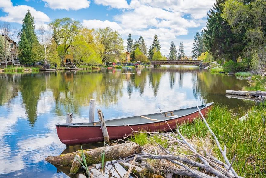 Amazing Deschutes River location between Downtown & Old Mill District.  Within blocks of Galveston corridor, Les Schwab Amphitheater, Drake Park, Columbia Park, Bend Whitewater Park, & Century Center providing countless opportunities for restaurants, shopping, music, entertainment, and recreation.  This stunning light & bright home boasts an open floor plan taking full advantage of fabulous river views through 24 ft tall floor-to-ceiling windows while entertaining or just relaxing in front of the vintage Malm fireplace.  The bedroom downstairs is a lock-off studio with its own full bath, wet-bar, and exterior entry door which could serve as a guest suite or rental.  Many upgrades throughout the home include: new flooring, interior/exterior paint, updated kitchen, 2 bathrooms updated, new light fixtures, new garage door, and many more.  Ample off-street parking to accommodate your vehicles & RV.  Come enjoy the Deschutes River lifestyle in this stellar location!