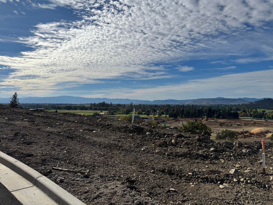 Introducing Quail Run Estates, Eagle Point's premier new subdivision of large luxury estate lots. Discover a rare opportunity to build your dream estate on one of these generous 1-acre view lots, perfectly situated overlooking the renowned Eagle Point Golf Community. These elevated home sites boast breathtaking, panoramic views of the golf course, surrounding mountains, and Rogue Valley. LOT 76