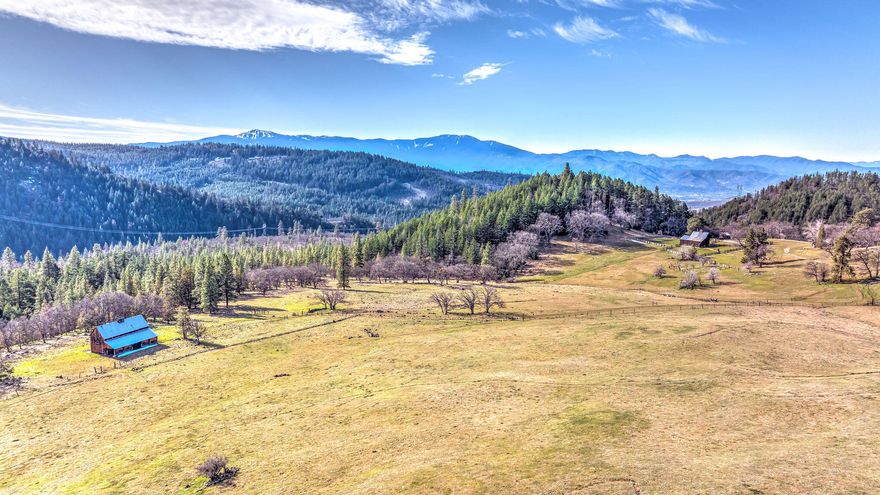 Just fifteen minutes from Ashland, Oregon, The Legend of Cove Creek Ranch is made up of 1,948± acres of rolling hills, meadows, timber, several creeks, and breathtaking mountain views in every direction. This ranch includes 255± acres of irrigation rights, three landowner preference tags, a homestead, three additional cabins, and unlimited recreation out your front door. Behind locked gates, privacy at the property is guaranteed. The ranch has extremely well-kept roads, which allow for excellent access to the entire ranch. If you get an itch for adventure, the outskirts of Ashland offer several mountain biking and hiking trails, numerous lake and rivers for boating, fishing and skiing, and downhill skiing at Mt. Ashland in the winter months. Whether you're yearning to hide away in the seclusion of the pines or looking for an eclectic in town experience with award-winning galleries, theaters and restaurants, The Legend of Cove Creek is sure to exceed all your expectations.