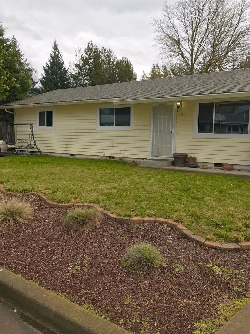 Come view all this charming home has to offer! This 3 bedroom, 1 bath, well maintained Eagle Point home features a large backyard, great size rooms and an updated bathroom with tile surround. Vinyl windows, central heat and air, a certified wood stove insert and warm paint colors make for a super comfy and cozy home. Also features a cute kitchen with a gas stove and area for a coffee bar or just extra counter space. Perfect for entertaining with the large backyard and ample parking. All this nestled in a nice quiet neighborhood AND for under $200k!