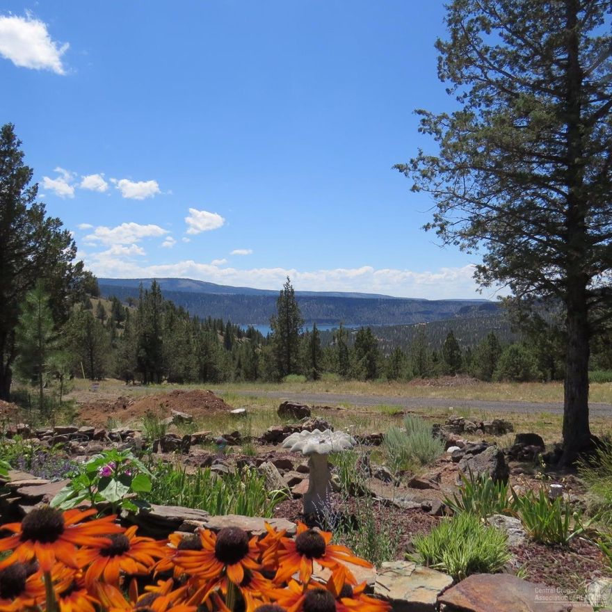 Ochoco Lake and MOuntain Views from this 96 Acre parcel, 3 bedroom 2 bath manufactured home, Open floor plan with a den, Woodstove. Kitchen has breakfast nook. Formal dining area. Plus a large double shop with extra storage, Detached garage and shop area. A must see property, on a dead end road. Little traffic.