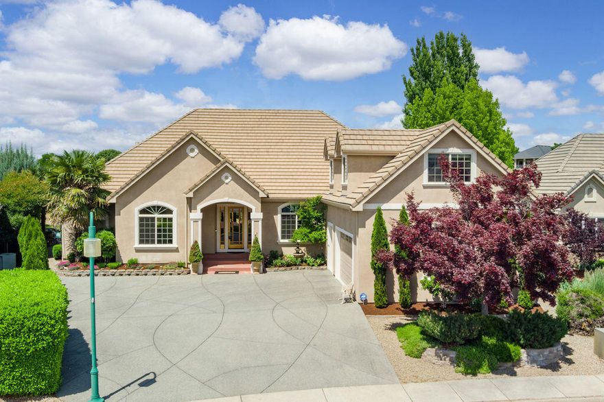 Eagle Point Golf Course overlooking the 4th Fairway w/a Pool! Gorgeous home with all the updates you are looking for. Soaring high ceilings & lg windows to take in the views! 8' tall doors, stone & hardwood floors, floor to ceiling stone fireplace in the great rm that is open to the kitchen w/island & 2nd sink, w/dbl ovens, 5 burner gas cook top, granite counters & pantry. Primary suite w/walk in closet, see thru gas log fireplace, lg tile shower w/duel shower heads, dbl sinks, jetted tub, water closet & slider that takes you to the back covered patio overlooking the beach entry lagoon heated pool w/water feature. Rod iron fenced backyard w/beautiful EZ care landscaping. 4 bdrms, 2.5 baths all on the main level. Upstairs bonus rm above the 3 car garage. Pride of ownership shows! Perfect quite cul-de-sac location close to hiking trails, clubhouse & pro shop.