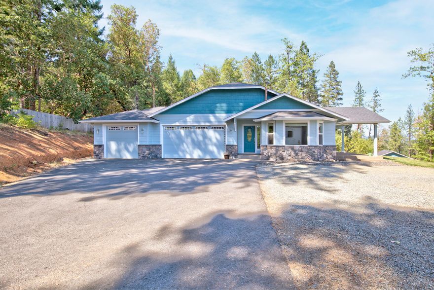 Your Oregon Dream Home! Located at the top of the mountain in the beautiful Rockinghorse Subdivision, this 3/2 is 2260 sq ft and sits on 2.34 acres. As you make your way through the home you will notice custom tile work, as well as welcoming archway pillars that lead into the family room. Vaulted ceilings throughout create a light and airy space & bay windows & sliders allow one to enjoy an expansive view of the outdoors. Large open kitchen features hickory cabinets, granite counters, slide-out drawers, crown molding with recessed lighting, pantry & stainless steel appliances. Decorative certified wood stove in the living room with slider that leads to the second covered patio. Split floor plan with a Master bedroom that includes walk-in closet, vanity with double sink, soaking tub, and separate shower. Other features include wide hall & door ways, a 20x30 shop, 3 car garage, stone siding, covered RV parking, gated entry, instant hot water, fenced in garden area & fruit trees.