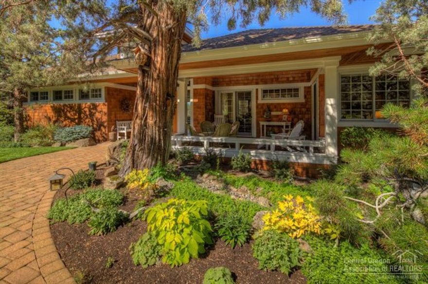 The serenity of nature surrounds you in this architecturally exquisite cottage design on one acre above the Deschutes River canyon. A welcoming, covered front porch opens to a grand foyer and the perfect great room, single level floor plan. Large picture windows capture the breathtaking Cascade mountain views. Drenched in light, the chef's kitchen offers top line appliances. Private and bordered by the river trail & park land, this is a slice of heaven on earth! Immaculately maintained inside & out.