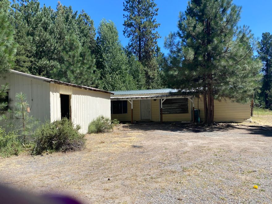Opportunity KNOCKS ! 
Take a look at this fabulous 8.23 acres in Fort Klamath
40x40 shop, additional garage, and several other outbuildings. 
The home could be repaired with a lot of work or a TEAR down 
Lots of timber on this property, and very private.