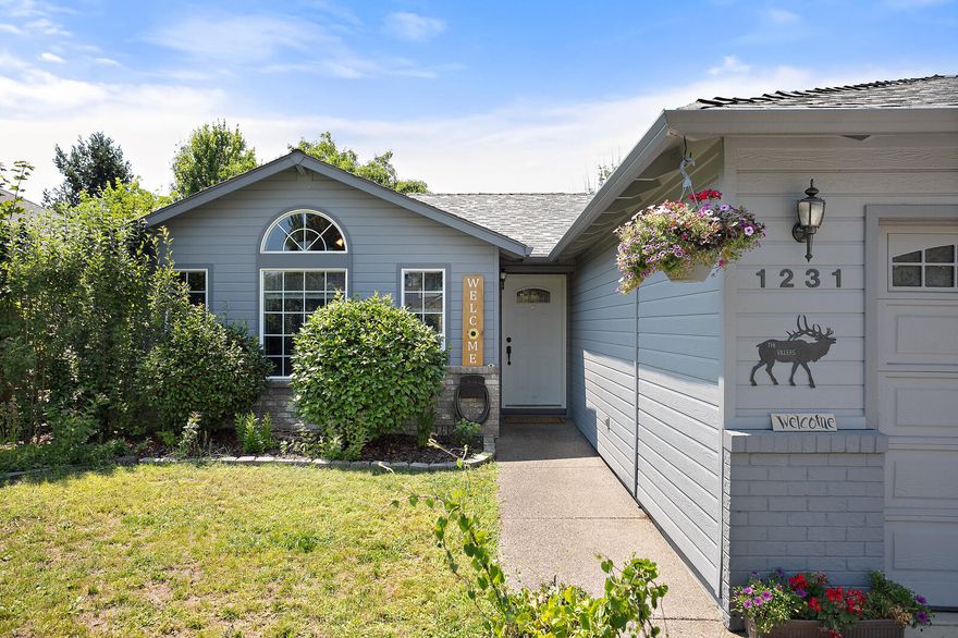 Welcome to this centrally located east medford home with an oversized lot that provides room for all your toys, rv and still plenty of room to build additional shop, she shed, or possibly even an ADU. This 3 bed 2 bath has vaulted ceilings in the living room, new laminate flooring, and a thought out layout that makes the home feel much larger than the stated sqft. The back patio and yard will Be a big hit with more than enough room to entertain and accommodate all your friends and family for this summer barbecues. The back yard fire pit is also a great place to gather. Garden boxes and established plum and apple tree provide the final touches that make you feel like you're in  the country not 5 min from the hospital and all your city conveniences.