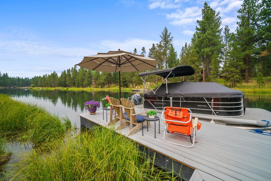 Truly a one-of-a-kind opportunity! This nearly new custom home sits on over 1.5 (+/-) acres of prime Deschutes riverfront, just minutes from Sunriver, Caldera Springs, & Crosswater. The main residence spans nearly 3,300 square feet & boasts a stunning two-story Great Room, a designer kitchen, & a main floor Primary Suite. Additional features include a loft, two guest bedrooms—one of which is ensuite—and an office. The property also includes a beautifully finished, heated 3-bay accessory building/shop with RV doors. Above the shop is a 910 sq. ft. bonus/media room complete with a full bath, kitchenette, and a private sun deck. Enjoy the serene outdoors with a deck off the loft & a large, elevated paver patio extending from the Great Room. An elevated walkway leads to a private dock on the Deschutes River, offering breathtaking Mt. Bachelor views—a perfect spot for a High Desert summer afternoon. Large riverfront parcels with such features and proximity to resort amenities are rare.