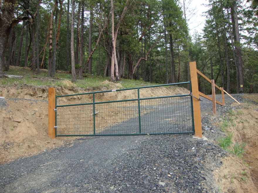 11.7 wooded acres with Homesite approval for sale. Water, Electricity and 4-bedroom home approved septic is installed. There is in place a 2000 gallon holding tank with pump house and the water is sourced from a 10 GPM shared well. This property backs up to BLM on 2 sides. Buyer to perform Due diligence.  Second property available, make an offer on 1 or both properties.