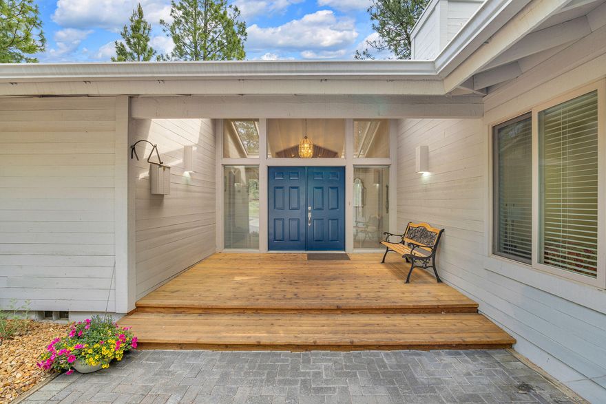 Car lover's dream home with attached 4 bay garage, including 2 bays heated and improved for craft room, plus a 1440 SF detached RV garage and shop with 2x6 construction. This 1977 Woodside Ranch Home offers the privacy and space of rural living, with amenities of the city. Updates include a 40 year roof, extension remodel to enlarge the primary bed/bath, newer larger study with built in file storage cabinets and bookcases and kitchen remodel in 2016. Large covered front porch with double doors and Travertine entry leads into a sunken living room with vaulted ceilings and river rock fireplace. Oversized windows bring in natural light and showcase the spacious, private yard. The kitchen was remodelled 9 years ago with new appliances.  Custom cabinets installed throughout and a large family room with wood-stove between the front entry and kitchen. Large decks on the back yard side of property, fenced with a sprinkler system and updated landscaping.