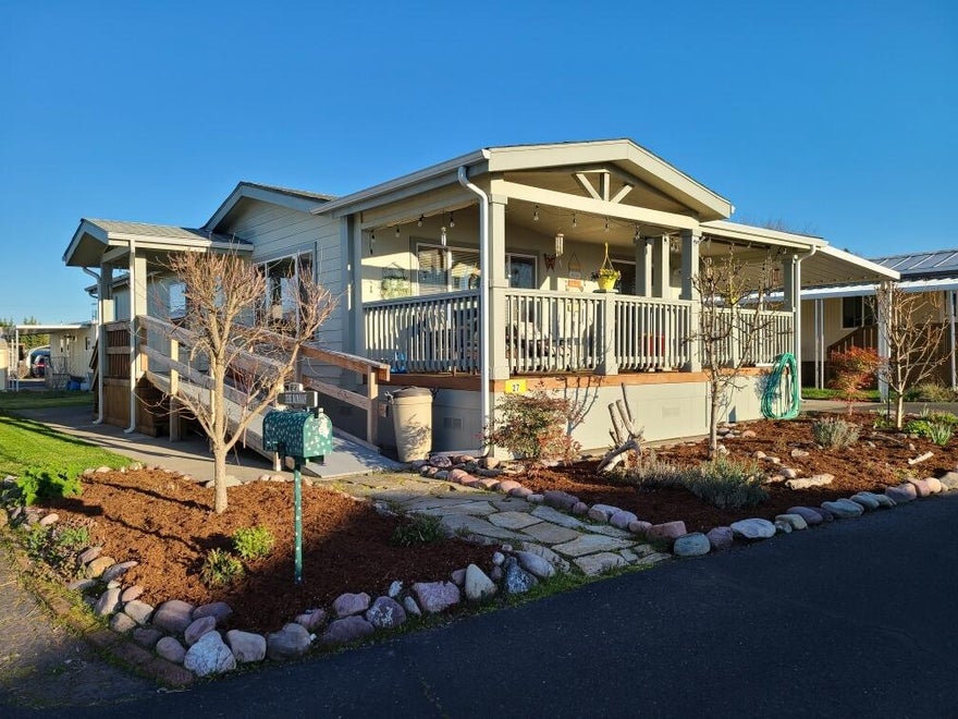 This beautiful 2005 Karsten MH is located in the Senior MH community of Riviera!  Spacious grounds lead to Rogue River Frontage which residents can enjoy year round!  Enjoy long range views of the mountains from inside or from the large covered deck which provides for tranquil outdoor entertaining & enjoyment year round!    Inside this delightful home is an open floorplan, a nicely appointed kitchen with new black stainless appliances.  The eating bar/counter can seat up to 6!  The adjoining dining area adjoins the spacious living area. Vaulted ceilings extend throughout the home giving this 1404 SF home a feeling of warmth & space. The floor plan was designed as 3 BR/2 baths & extra storage throughout. The primary bedroom has spacious closets in both the bedroom & primary bath.  Enjoy the soaking tub or large shower! With low park rent of $500 comes trash, water & sewer! RV Pkg available! Electric is billed per unit by the park.  Park Approval is required.