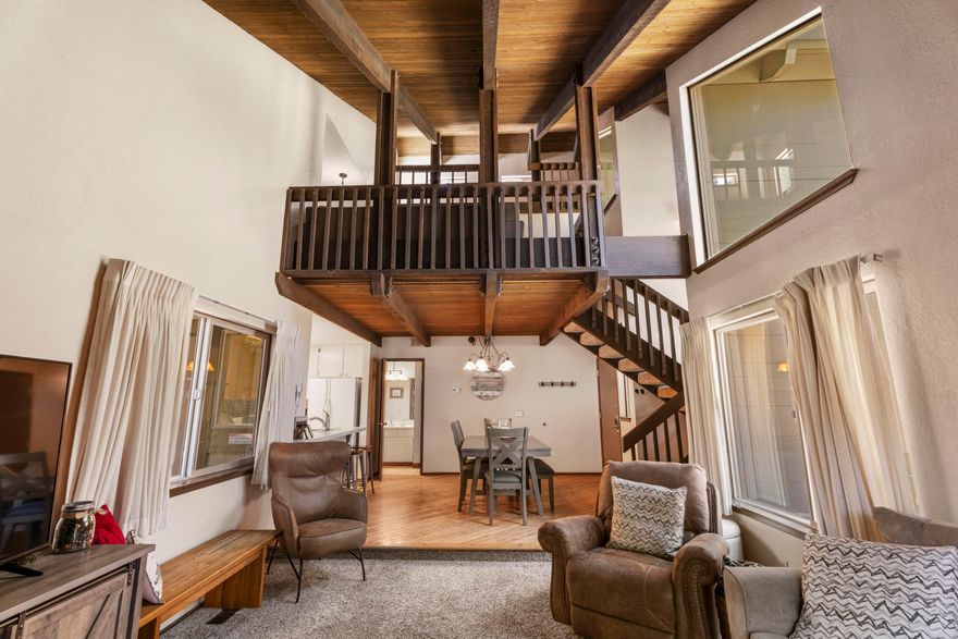 Ready for retreat!? This is the ideal central location in Sunriver! Located seconds from the spa, shopping mall, restaurants, pubs, and the lodge and a short distance to SHARC and more amenities. Inside, you'll find 2 spacious bedrooms, 2 full bathrooms, and a generous loft perfect for extra sleeping space or a flexible retreat. The open floor plan features soaring ceilings, exposed beams, and a dramatic floor-to-ceiling wood-burning fireplace, all accented with warm wood tones throughout. Additional highlights include ample exterior owner storage and a strong long-term rental history, making this a great investment or vacation getaway.