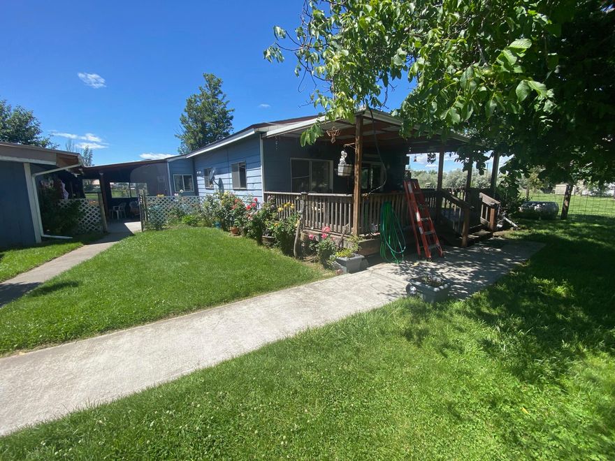 Stunning country setting home! This property has allot to offer with plenty of pasture for any livestock you'd like. Has water rights! The home needs some love but has allot of potential. There's a room with outdoor access, tub, toilet and sink that would be a great mother in law apartment. There's a large shop/garage space and room outside to park an RV and any toys you may have. Won't last long call today!